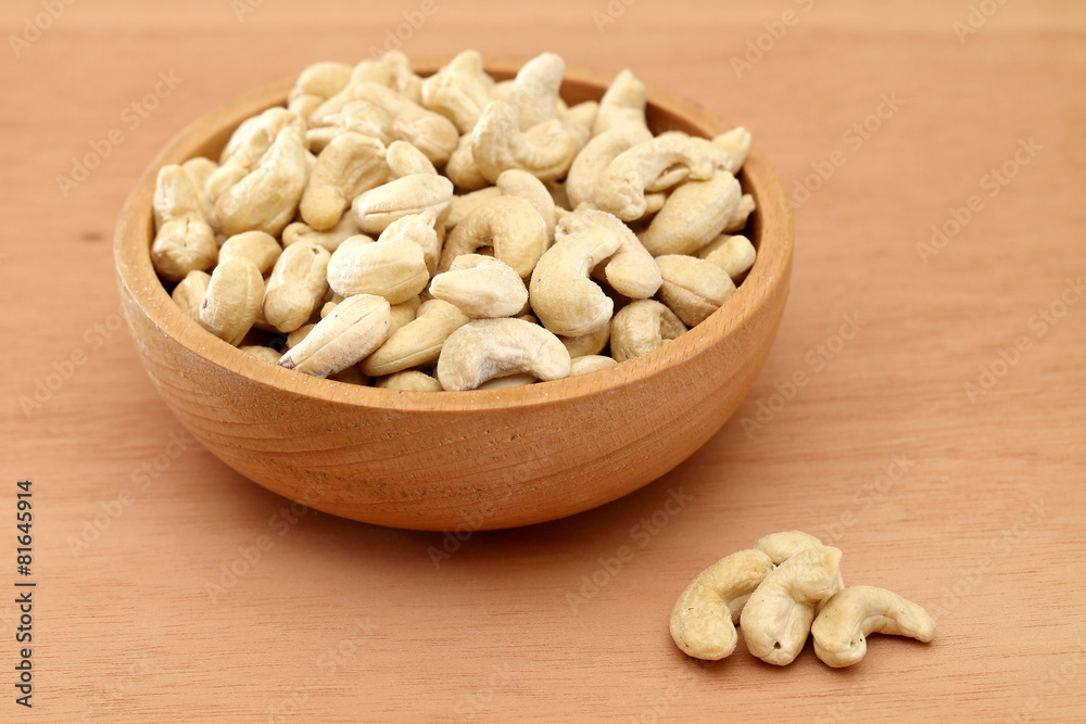 Cashew nuts in a wooden bowl Cashew nuts in a wooden bowl