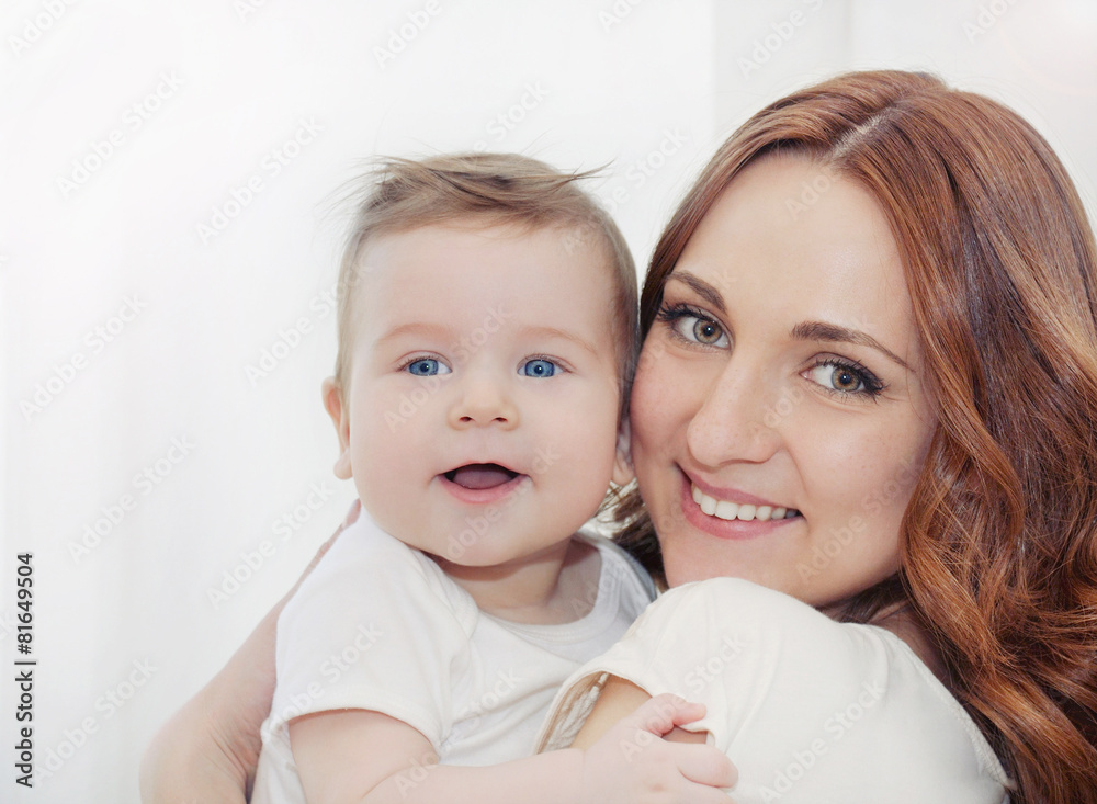 happy family potrait of beautiful young mother and her cute litt happy family potrait of beautiful young mother and her cute litt
