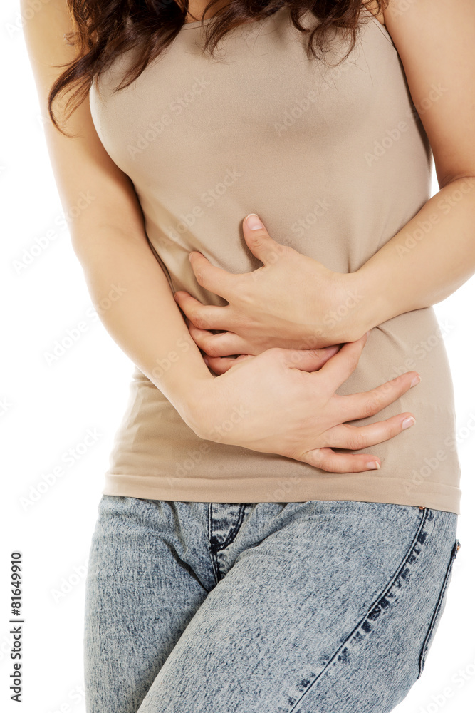 Woman suffering from severe pain in her tummy. Woman suffering from severe pain in her tummy.