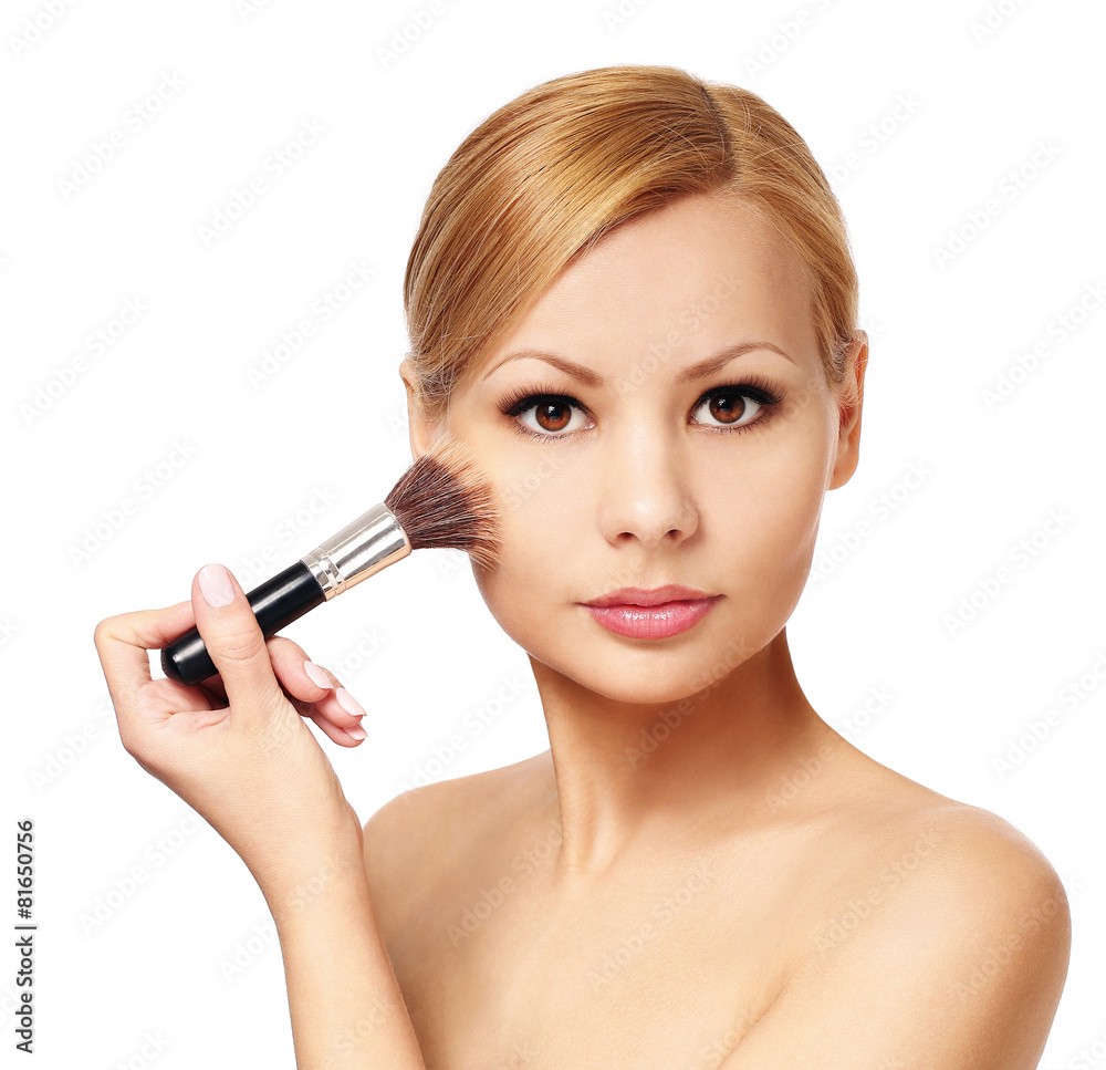 Beautiful woman with makeup brush isolated. Blonde Beautiful woman with makeup brush isolated. Blonde