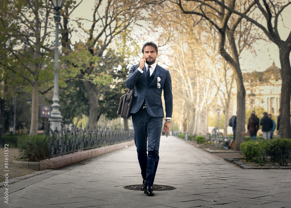 Handsome businessman walking