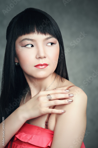 Shy Asian girl smiling  closeup portrait.