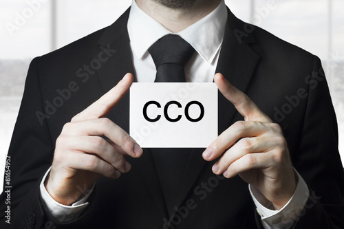 businessman holding small white sign cco photo