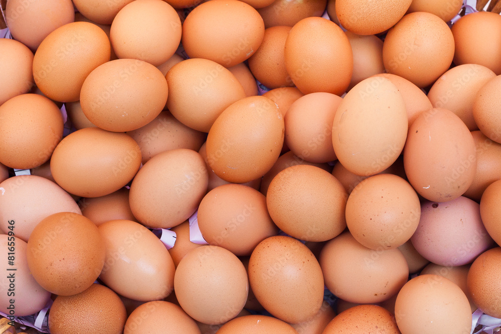 Chicken eggs in a basket isolate on white background Chicken eggs in a basket isolate on white background