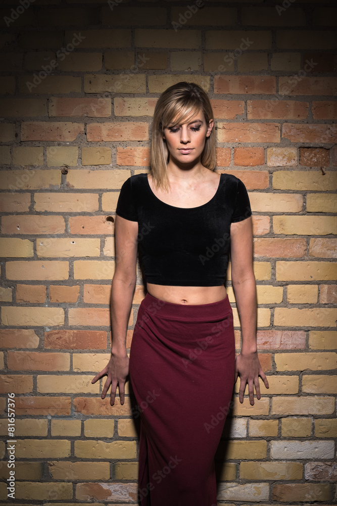 Portrait of Young Attractive Woman Against Brick Wall Portrait of Young Attractive Woman Against Brick Wall