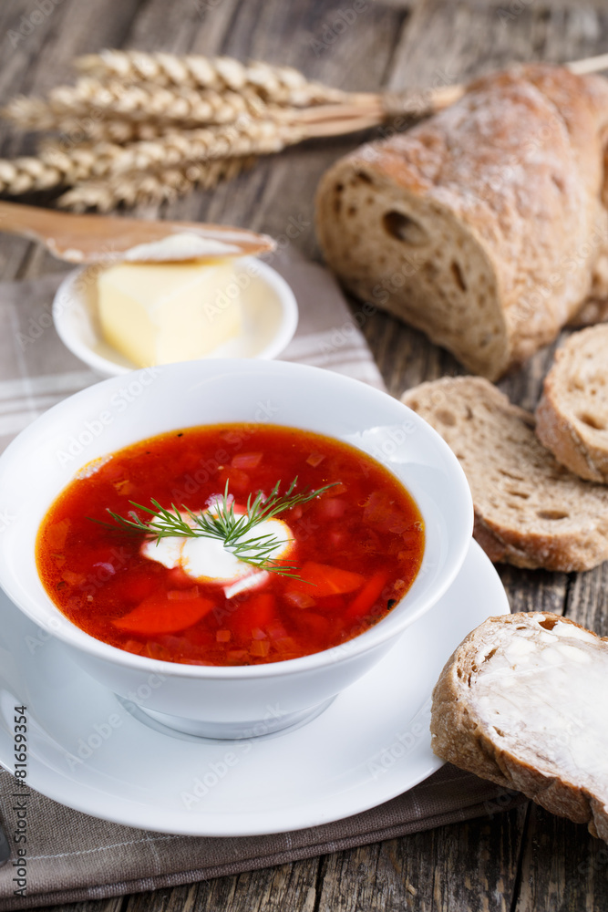 Tasty soup with bread on a wooden background. Tasty soup with bread on a wooden background.