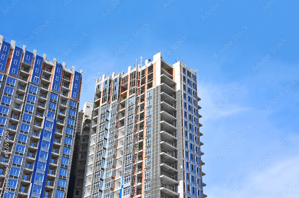 Building construction site work against blue sky