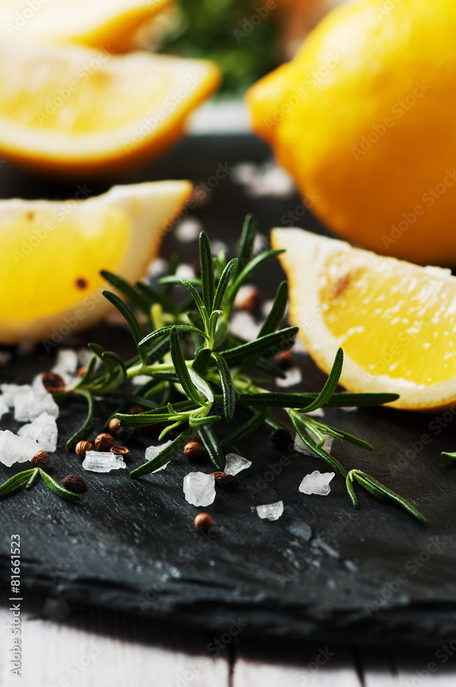 Rosemary, lemon and salt on the table