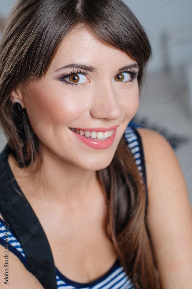 Beautiful happy woman posing in studio closeup Beautiful happy woman posing in studio closeup