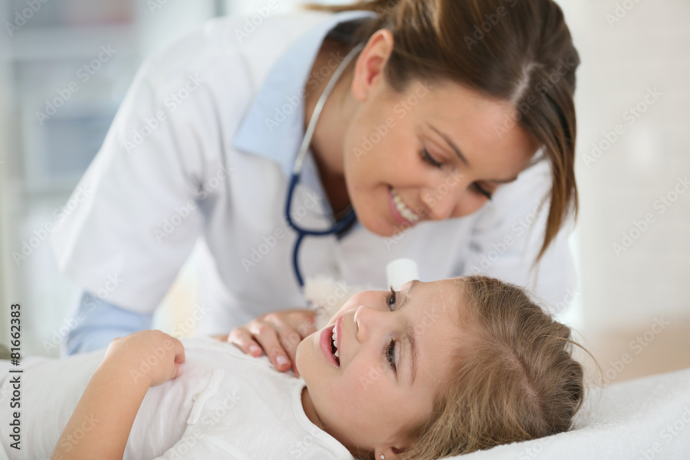 Doctor checking on child's ear Doctor checking on child's ear