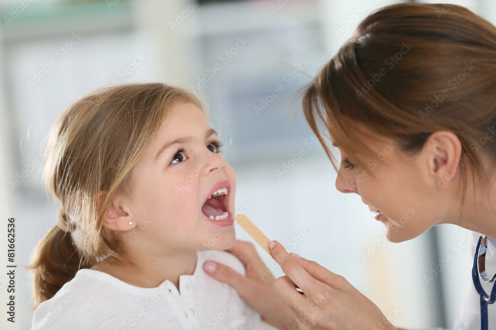 Doctor examining child's throat and mouth Doctor examining child's throat and mouth