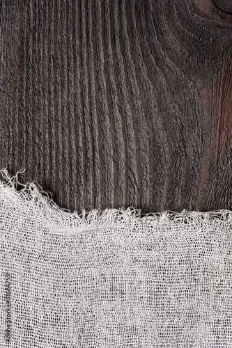 Dark wood and cheesecloth background