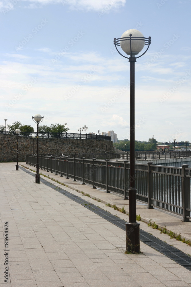 A row of lanterns on the city embankment.