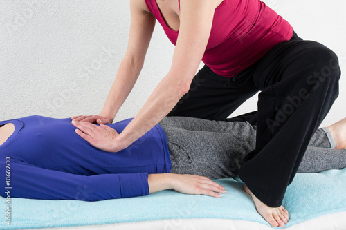 Nice and Young Woman having a Shiatsu massage