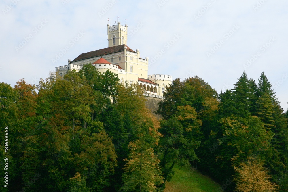 Castle on the woody hill, in autumn