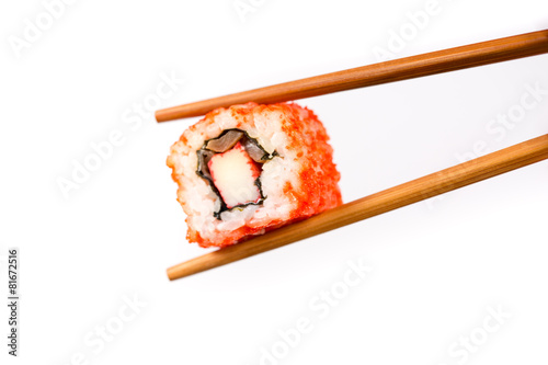 Sushi roll with bamboo chopsticks isolated on white background