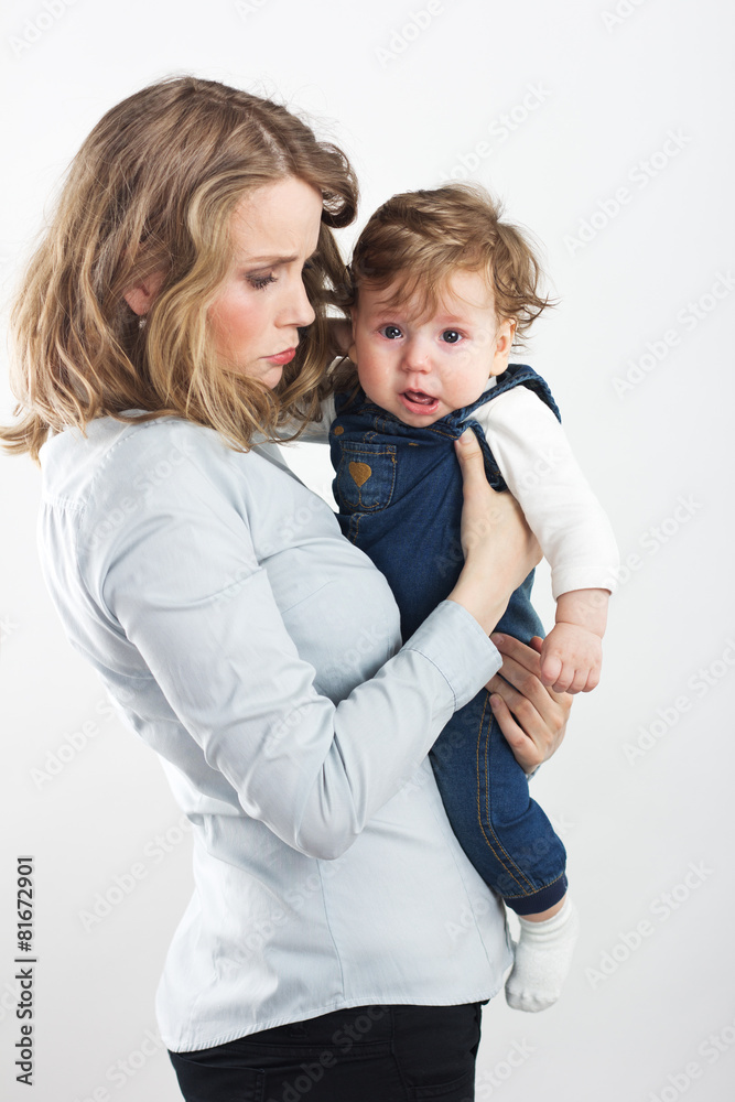 young mother with a little boy in her arms. young mother with a little boy in her arms.