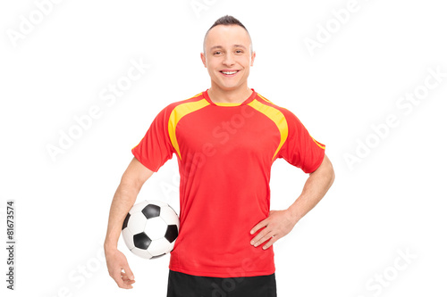 Football player holding a ball and smiling