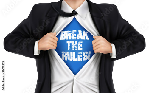 businessman showing Break the rules words underneath his shirt