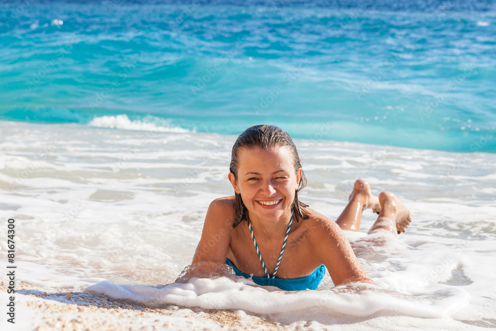 Fototapeta premium Young woman resting on the beach Kaputash, Turkey