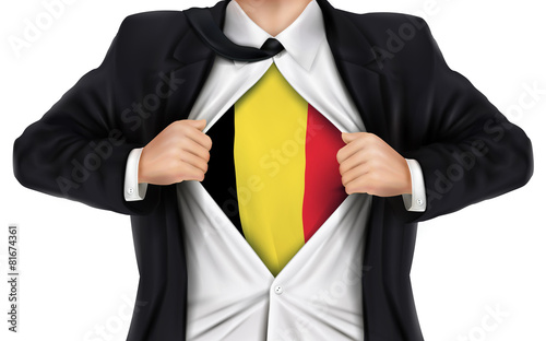 businessman showing Belgium flag underneath his shirt