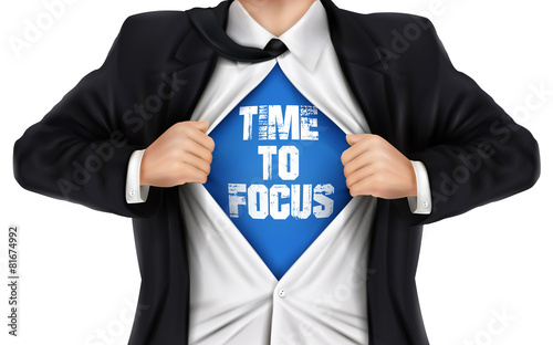 businessman showing Time to focus words underneath his shirt