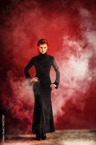 Woman posing in elegant long dress © smmartynenko