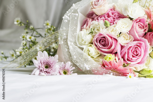 Bouquet on the bed in bedroom