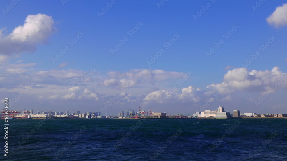 Blue sky timelapse over Tokyo's industrial waterfront Blue sky timelapse over Tokyo's industrial waterfront