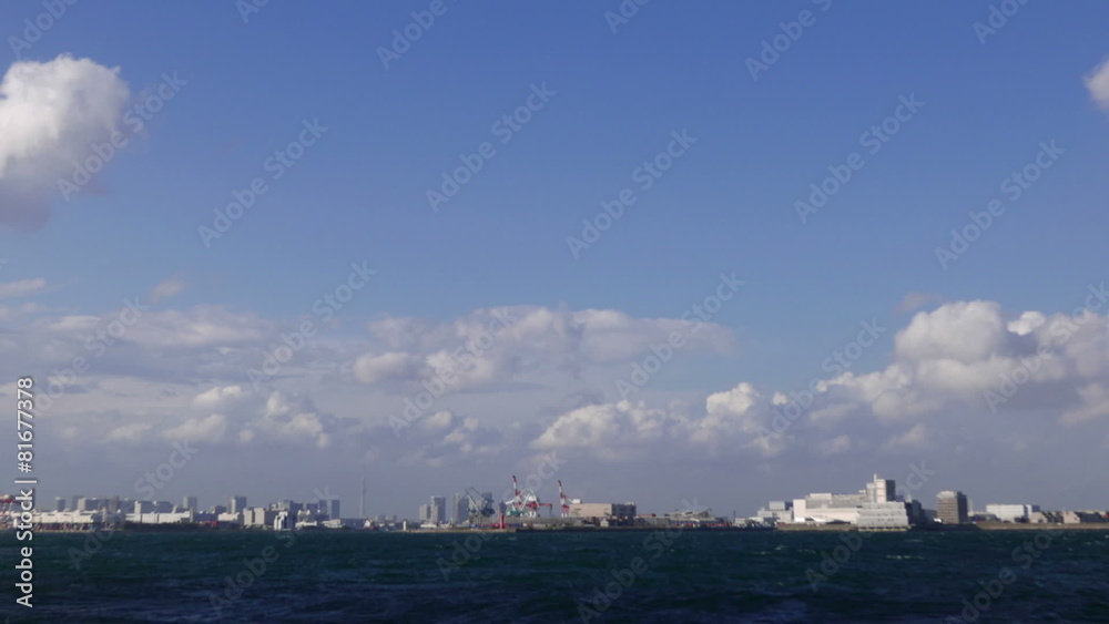 Blue sky timelapse over Tokyo's industrial waterfront Blue sky timelapse over Tokyo's industrial waterfront
