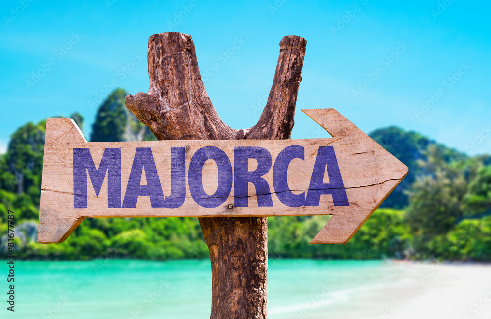Majorca wooden sign with beach background
