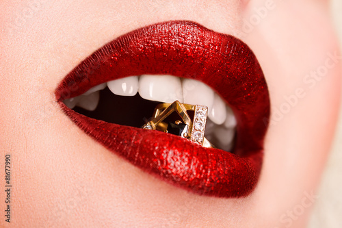 Beautiful red glossy lips close-up, macro photography