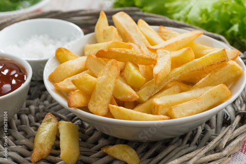 fried french fries with tomato sauce, close-up