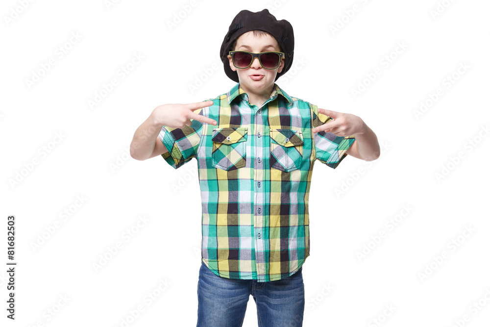 Little boy with a cap and glasses doing victory gesture