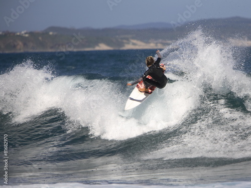 Adrenaline seeking surfer surfing in the ocean
