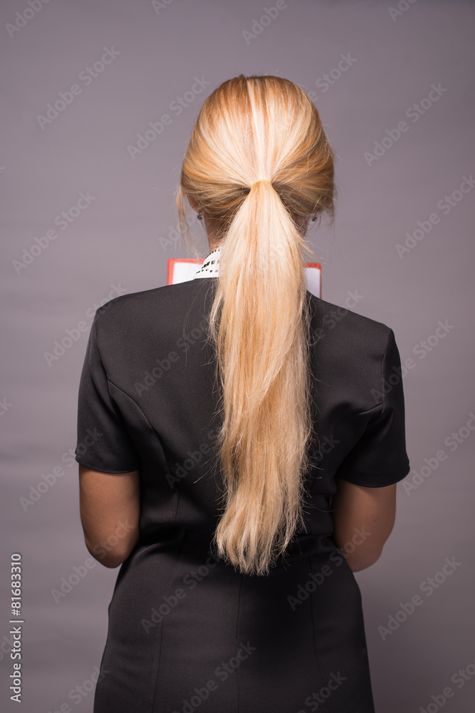 Naklejka premium back of girl with beautiful long blonde hair