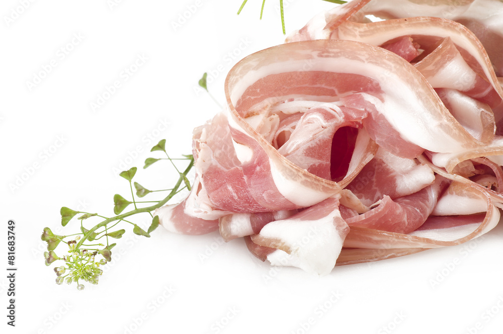 Bacon sliced close up on the white Bacon sliced close up on the white