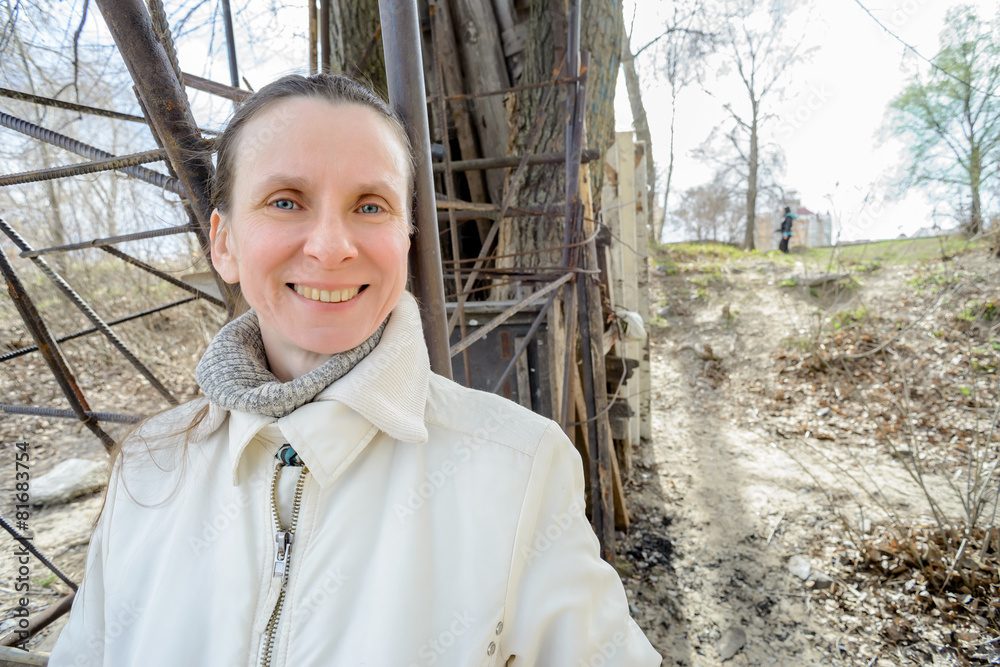 Smiling, sweet and cheerful adult woman outdoor during a nice spring day Smiling, sweet and cheerful adult woman outdoor during a nice spring day