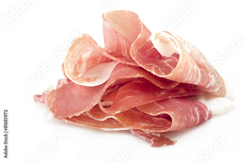Italian prosciutto crudo ,raw ham leg sliced on white © Orlando Bellini