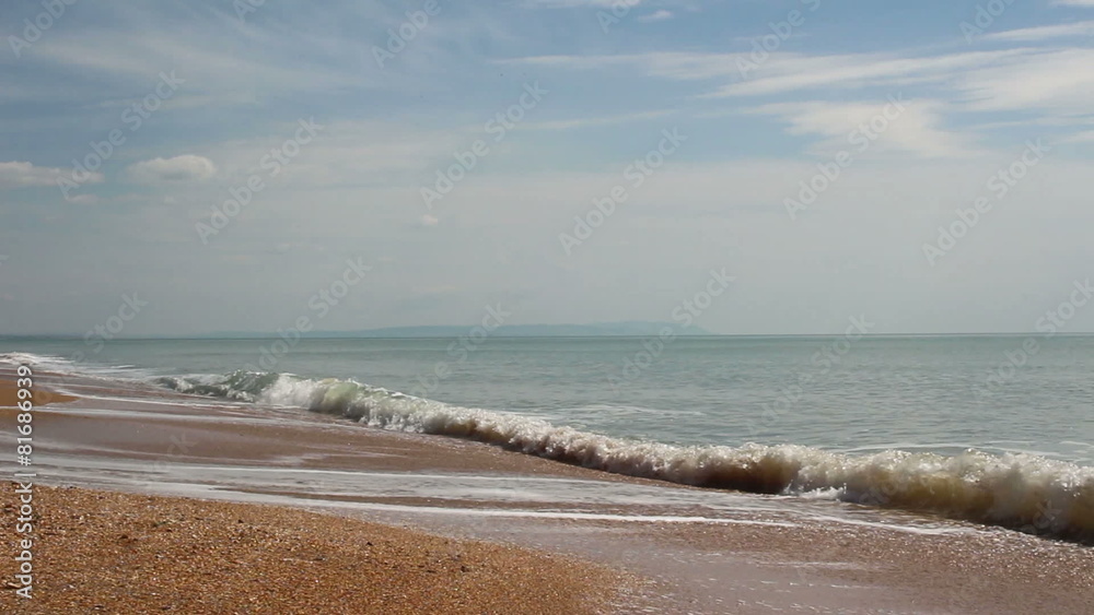 light waves on the seaside in cloudy day light waves on the seaside in cloudy day
