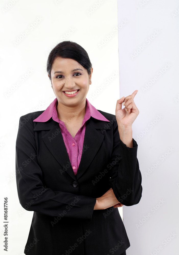 happy business woman showing blank signboard