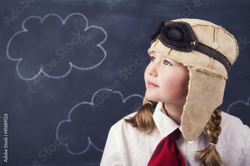 young girls with aviator goggles and hat photo