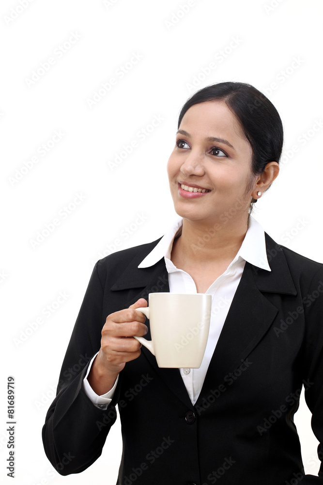 Young happy business woman with a cup of coffee Young happy business woman with a cup of coffee