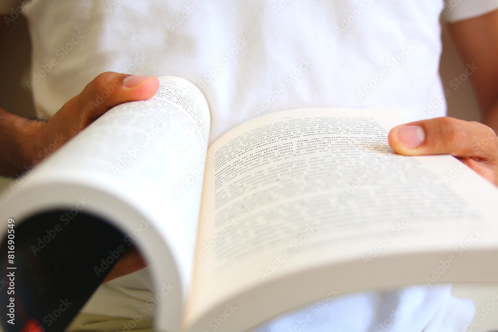 Fototapeta premium Person holding a book.