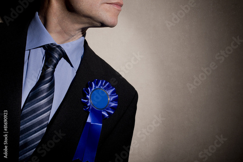 Election Candidate With Blue Rosette