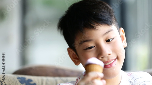 Little asian cute boy enjoy eating an ice cream
