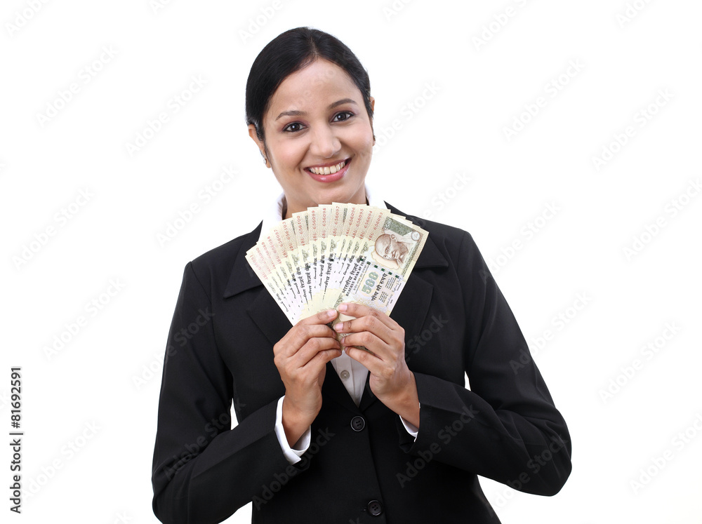 Young business woman holding Indian currency notes Young business woman holding Indian currency notes