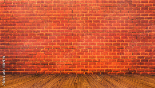 Wood floor and red brick wall background