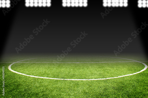 Soccer ball on field in stadium