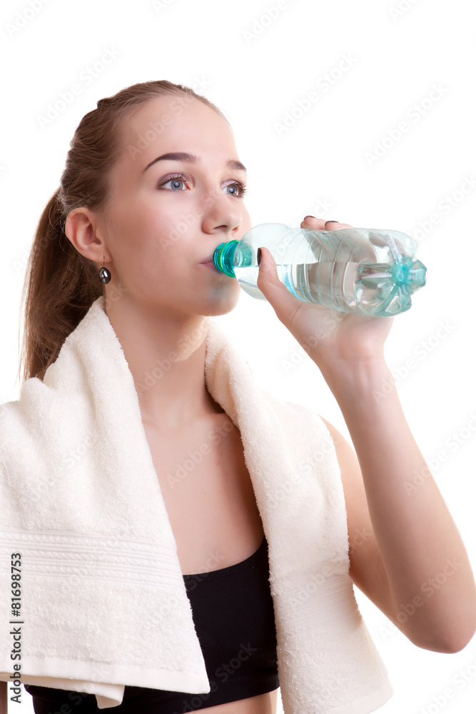 Young healthy girl with bottle of water in hands Young healthy girl with bottle of water in hands